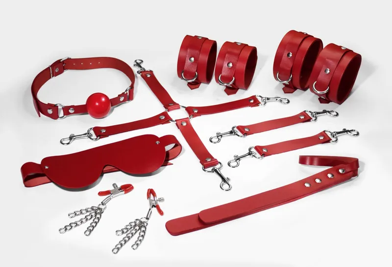 Набір Feral Feelings BDSM Kit 7 Red: наручники, поножі, конектор, маска, паддл, кляп, затискачі